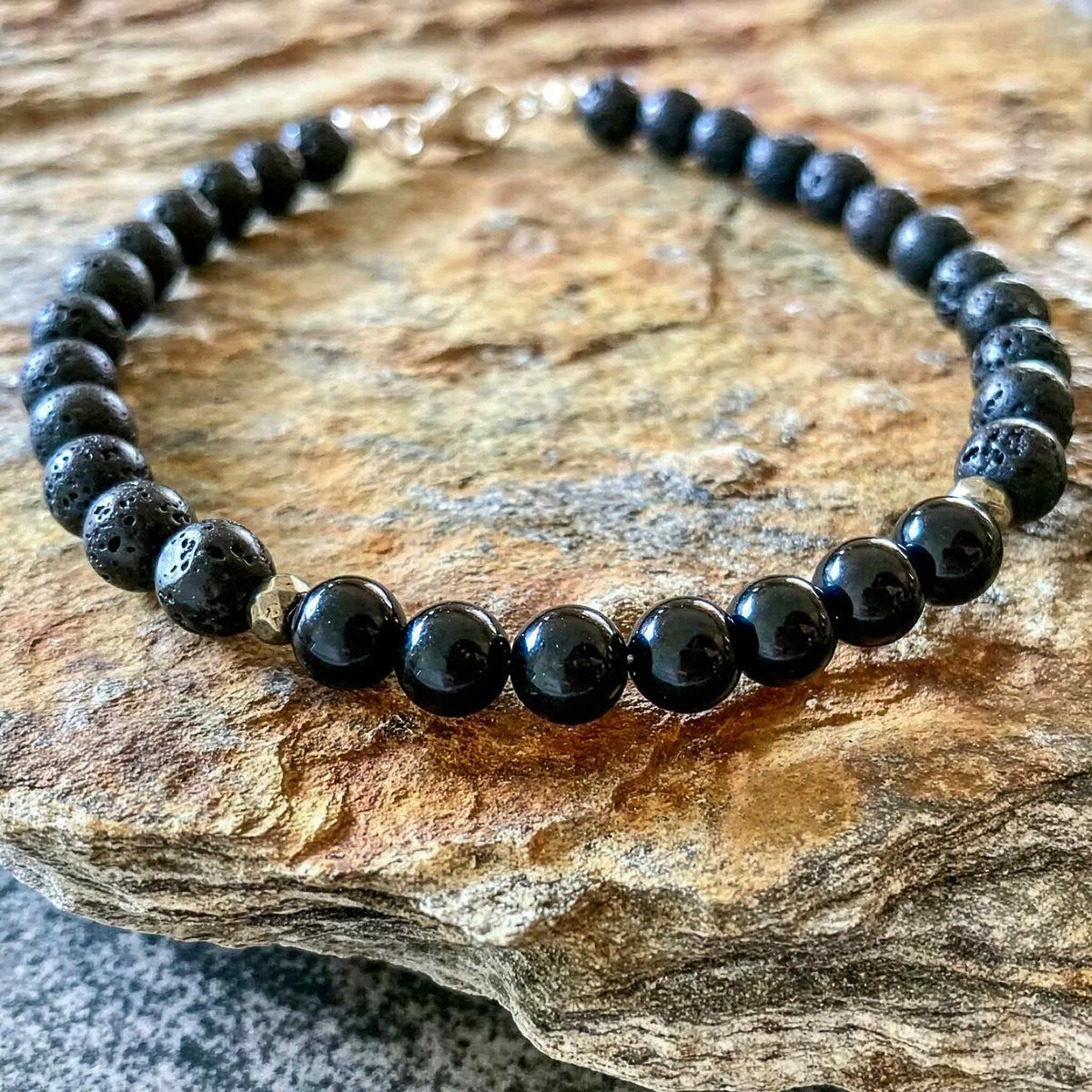 Black tourmaline beads with small pyrite accents on the Inner Strength bracelet
