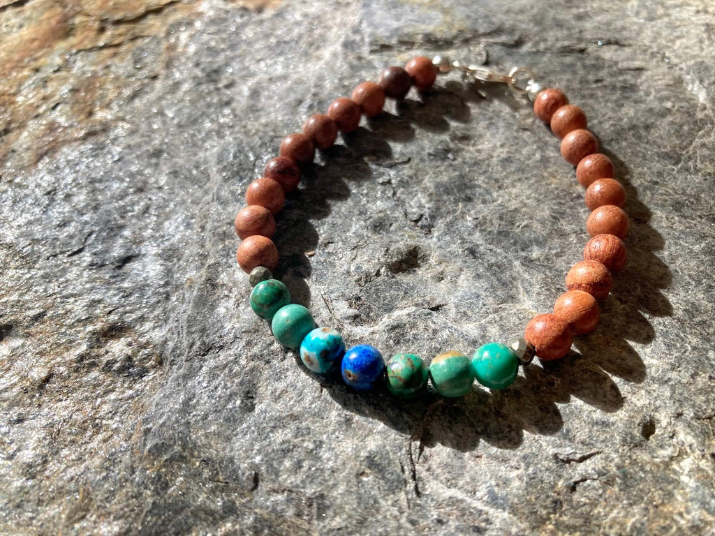 Close-up of azurite beads with deep blue and green patterns on the Inner Wisdom bracelet