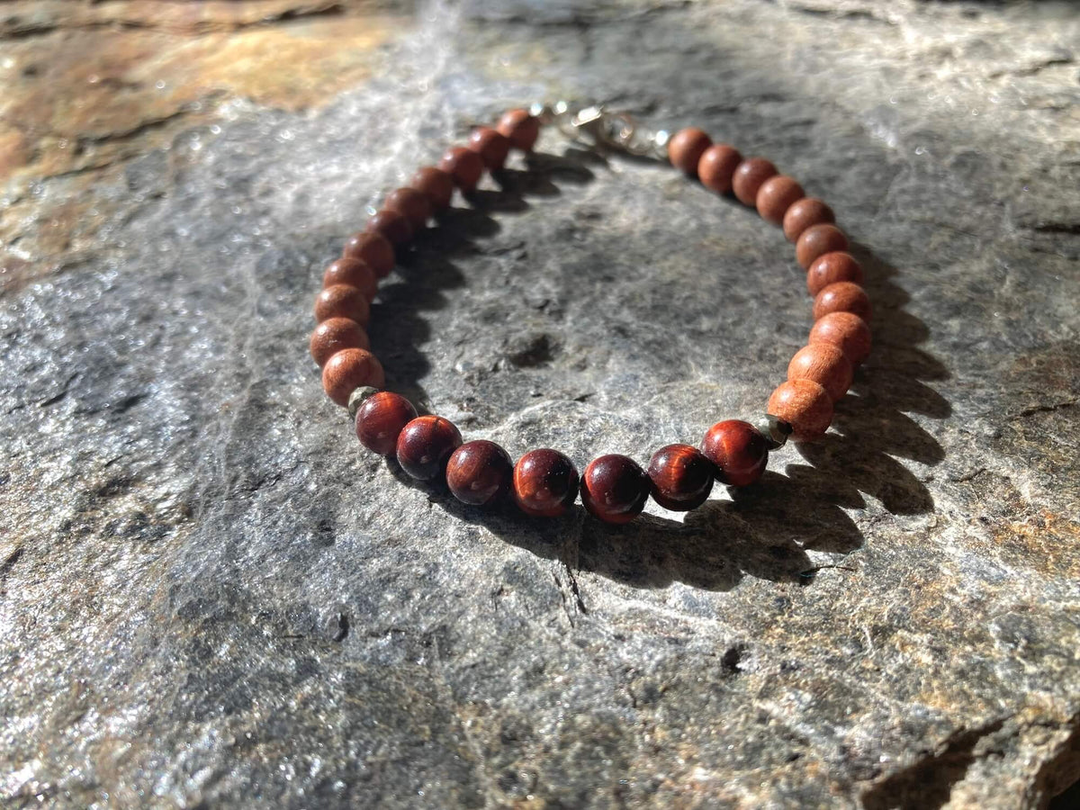 Close-up of banded red tiger's eye beads on the Motivation bracelet