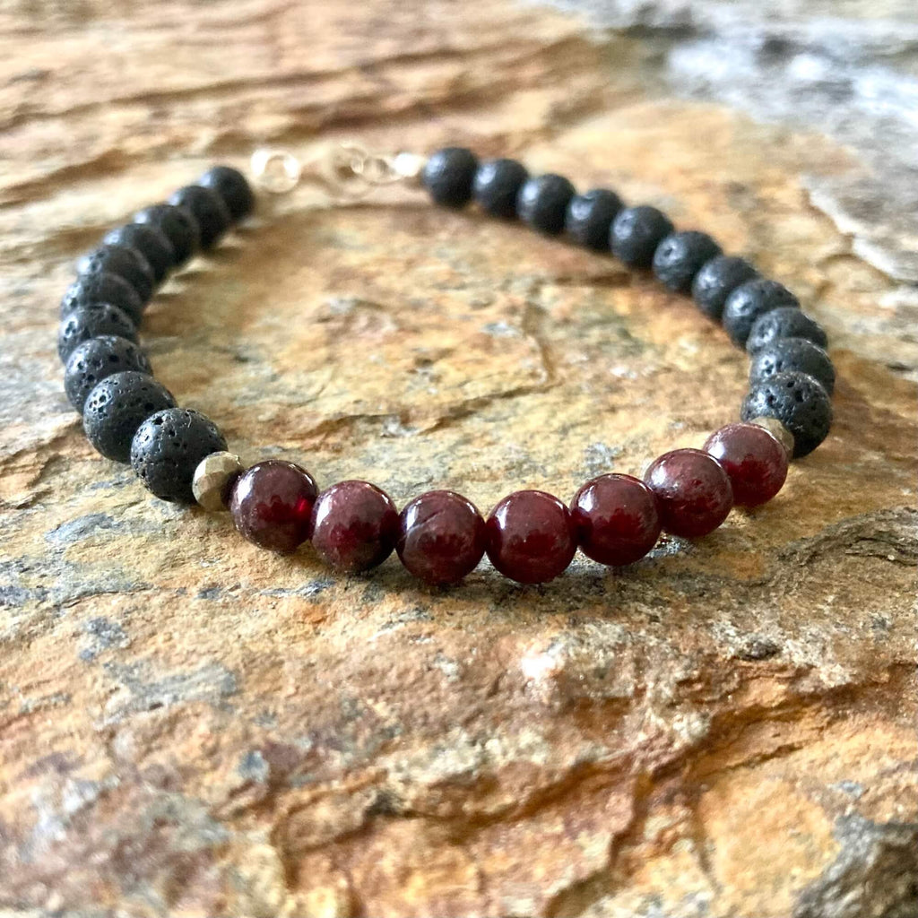 Close-up of dark red garnet beads on the Prosperity bracelet