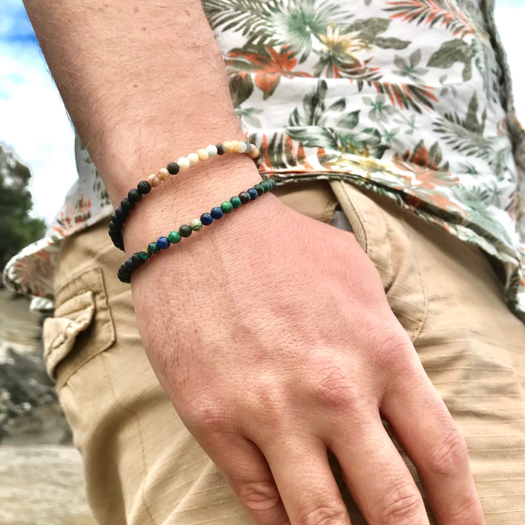 Close-up of the Vitality bracelet worn on the wrist, stacked with a second bracelet