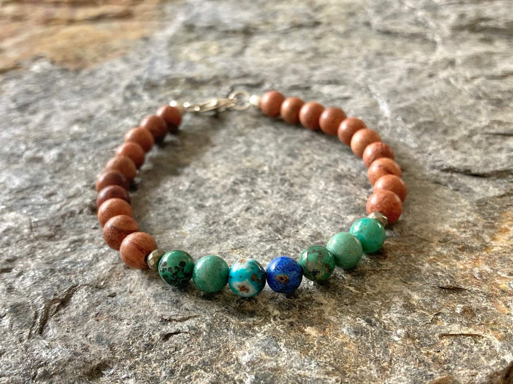 Deep blue azurite centre bead on the Inner Wisdom bracelet, on stone