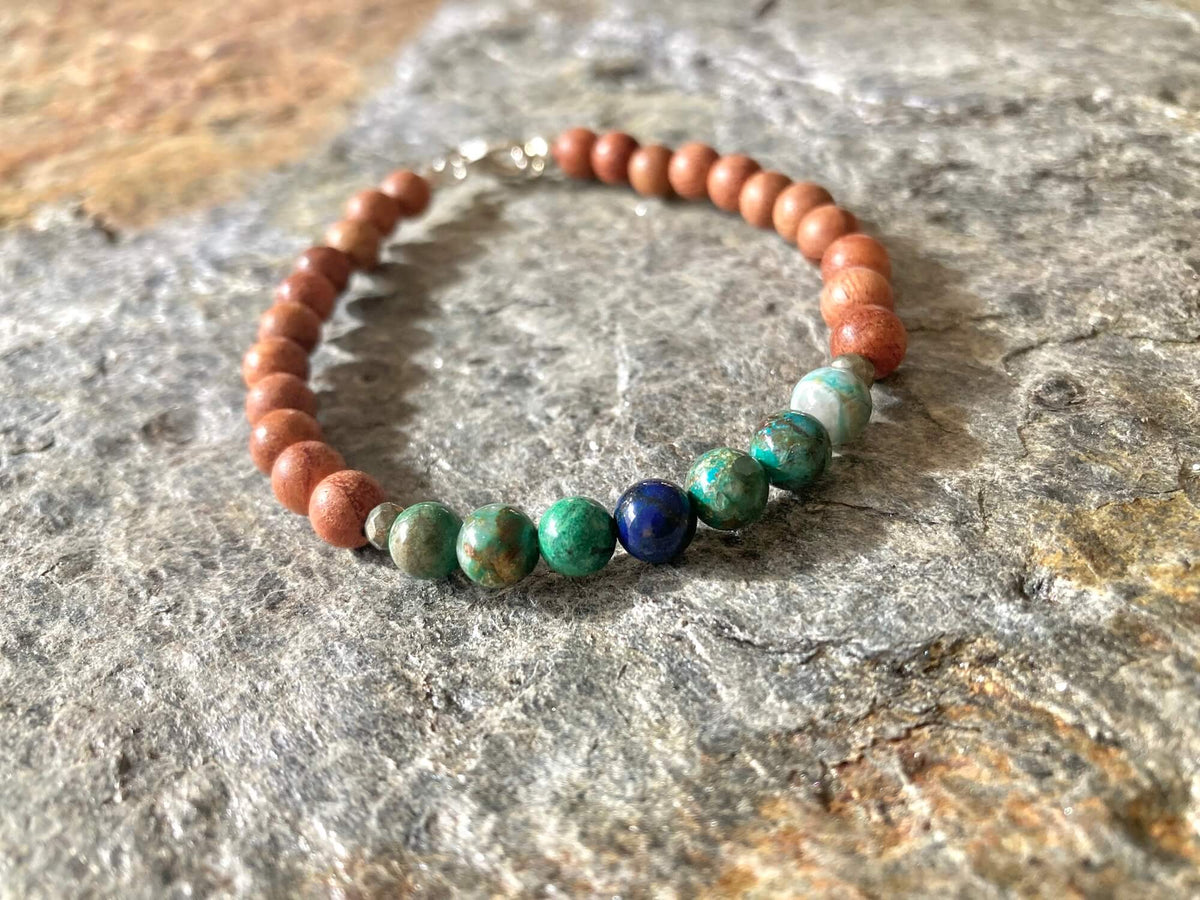 Inner Wisdom bracelet on grey stone, azurite beads at the front