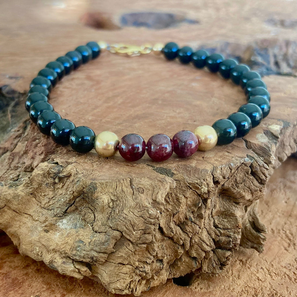 Men's spiritual bracelet featuring garnet and black obsidian crystals