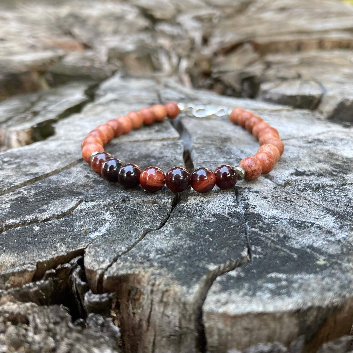 Motivation bracelet on an old tree stump, sterling silver clasp at the top
