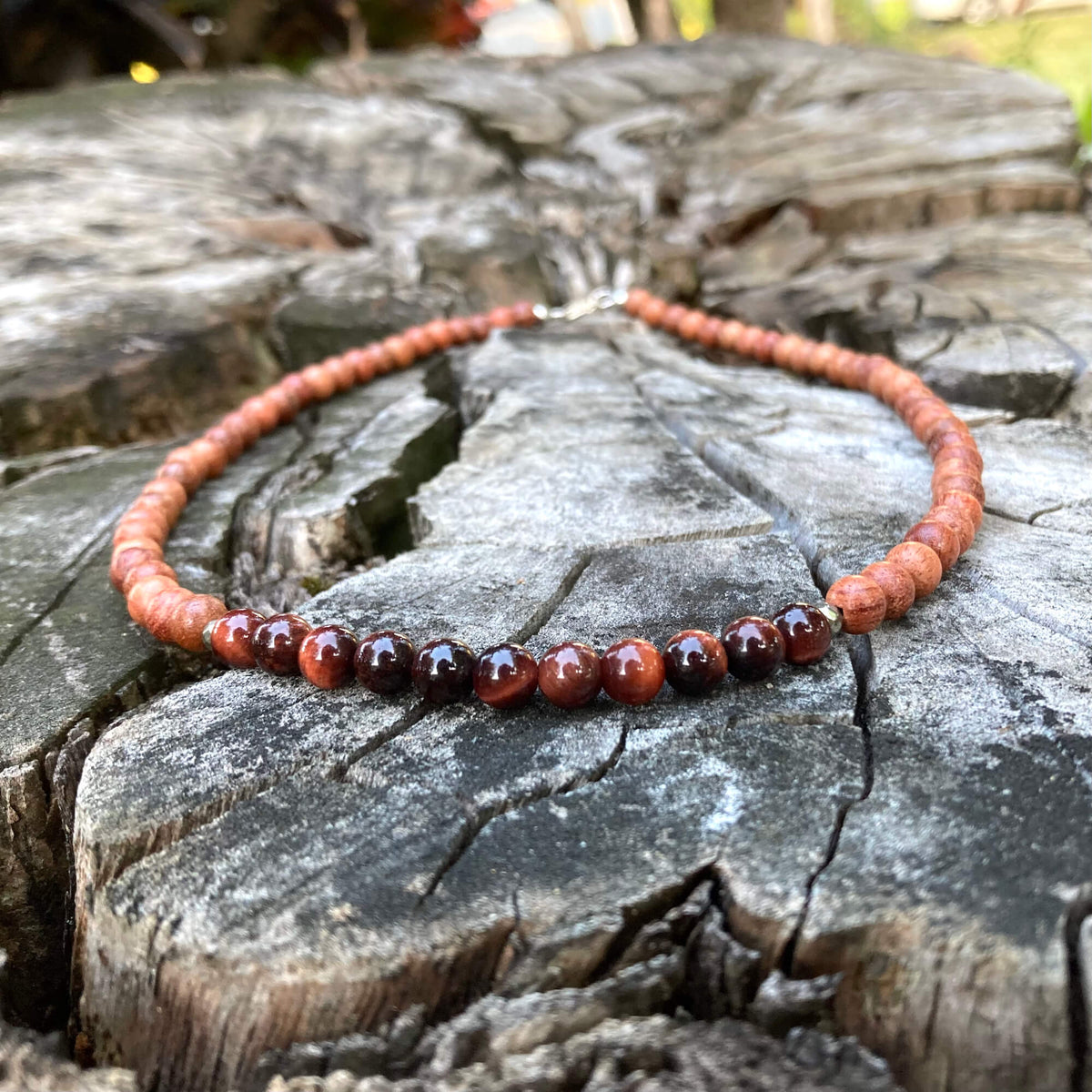 Motivation necklace on a stump, sterling silver clasp at the top