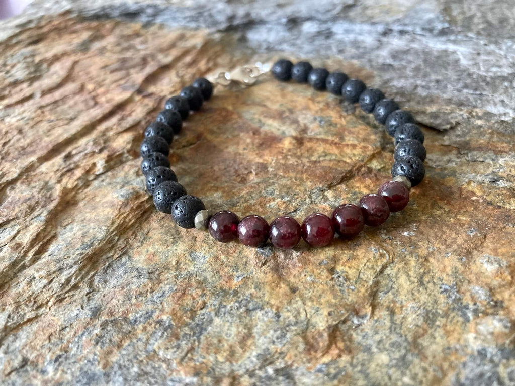 Prosperity bracelet on layered sandstone, seen from the side