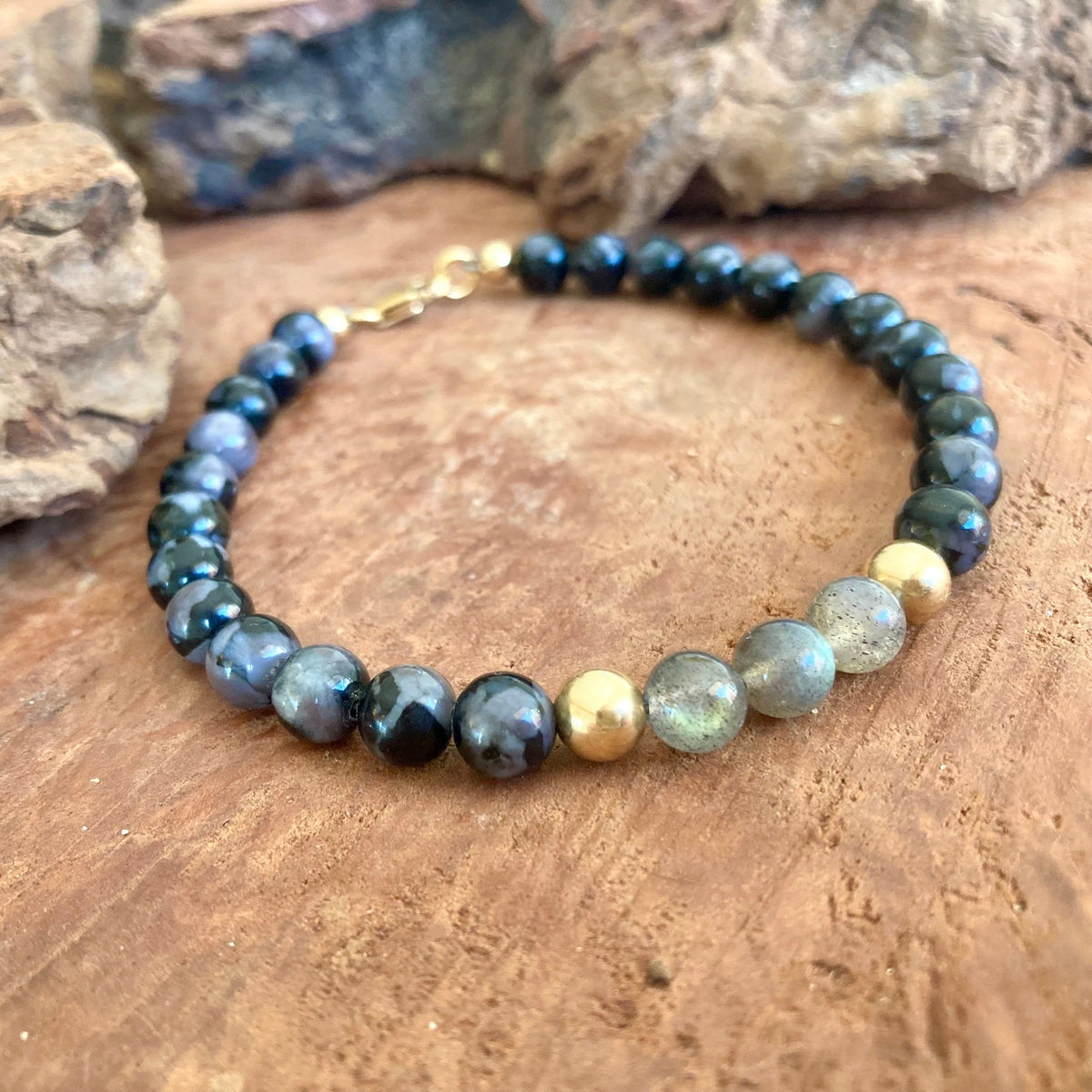 The Shadow Walker bracelet seen from above, gold-fill clasp at the top