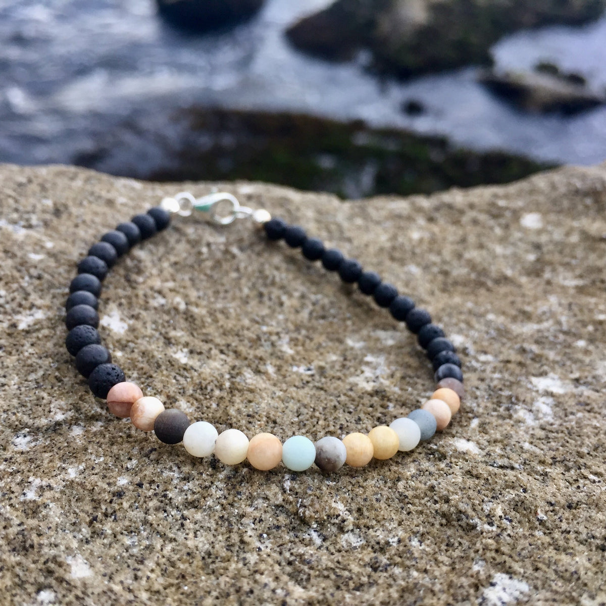 Vitality bracelet on coastal rock with the sea behind