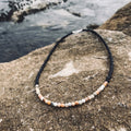 Vitality men's necklace: peach sunstone and pale blue amazonite with black beads, on sandstone
